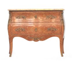 A French marble topped, kingwood and ormolu commode, c.1900, of bombe form, the two drawers with