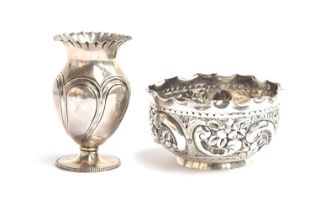 A late Victorian silver bowl by Norton & White, Birmingham 1899, heavily chased with scrolls and