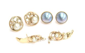 Three pairs of pearl earrings: a pair of 9ct gold and grey mabe pearl studs, 1.4cm diameter; a