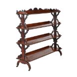 A mid 19th century mahogany four tier etagere, 124cm high, 132cm wide, 31cm deep