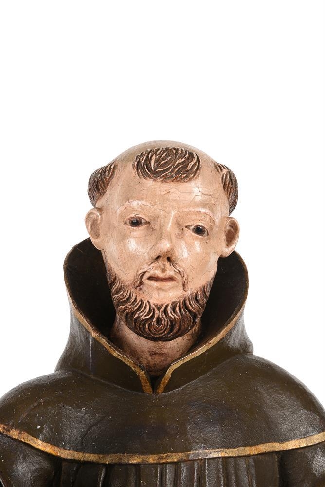 A 19th century carved and polychrome painted model of a monk, possibly St. Francis of Assisi, with - Image 2 of 2