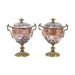 A pair of late 19th century Samson porcelain and gilt metal mounted two handled pedestal cups and