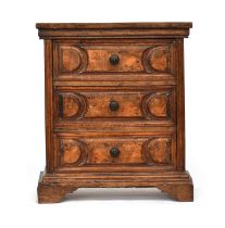 An 18th century Italian walnut chest of three drawers, with heavy mouldings on bracket feet; 72cm