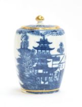 An 18th century Caughley porcelain barrel shaped tea caddy c.1775, decorated with pagoda scenes