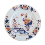 A large Chinese Imari charger, Kangxi, painted to the interior with lotus pond scene, 35cm diameter