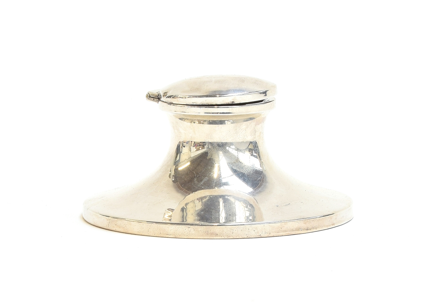 A George V silver capstan inkwell, the base 10.7cm diameter, with mismatched glass liner, Chester