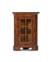 A walnut floor standing corner cabinet, incorporating 18th century elements, 58cm wide, 35cm deep,