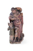 An early 19th century carved and polychrome figural group, possibly Swiss Tyrol, depicting a man