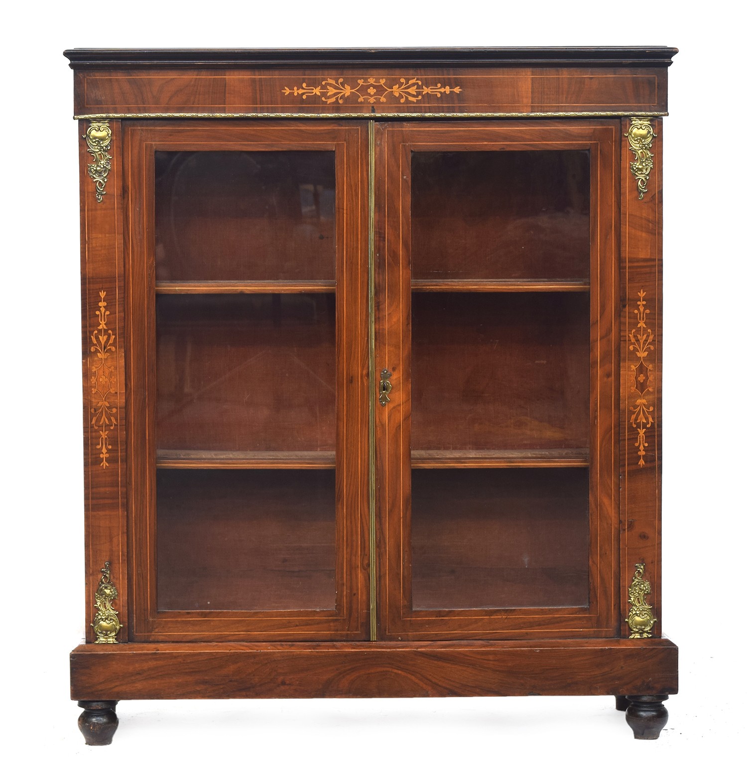 A 19th century walnut and marquetry pier cabinet, the glazed doors opening to two adjustable