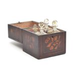 A 19th century mahogany and marquetry four bottle decanter box, with key and papered interior, the