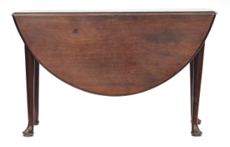 A George II mahogany oval drop leaf table on tapering turned legs and pad feet, 122cm wide, 44cm