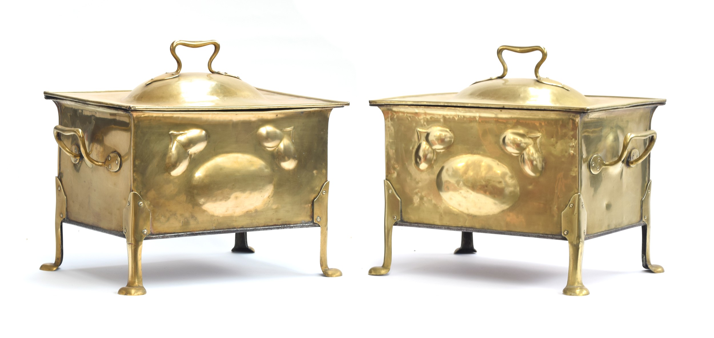 A pair of large Art Nouveau brass coal scuttles, with liners, 52cm wide, 34cm deep, 42cm high