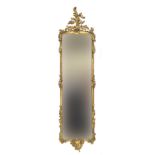 A mid-19th century gilt gesso pier mirror, with grape and vine cresting, 56cm wide, 196cm high