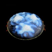 An Etling opalescent glass dish, the exterior moulded with floral sprays forming the feet, moulded