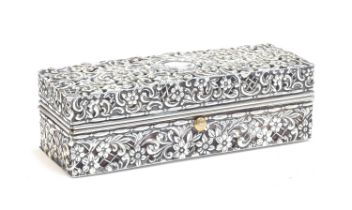 A pierced silver pen box by Henry Matthews, London 1895, all over chased with scrolling foliate