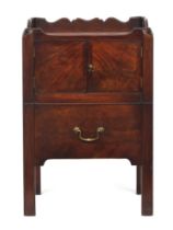 A George III mahogany tray top night commode, galleried with handles, over a pair of doors above
