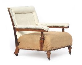 A late 19th century open armchair by Holland & Sons, on turned front legs, the back legs stamped