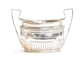 A George III twin handled silver sugar bowl, London 1802, half gadrooned body, 18.5cm wide, 9.8ozt