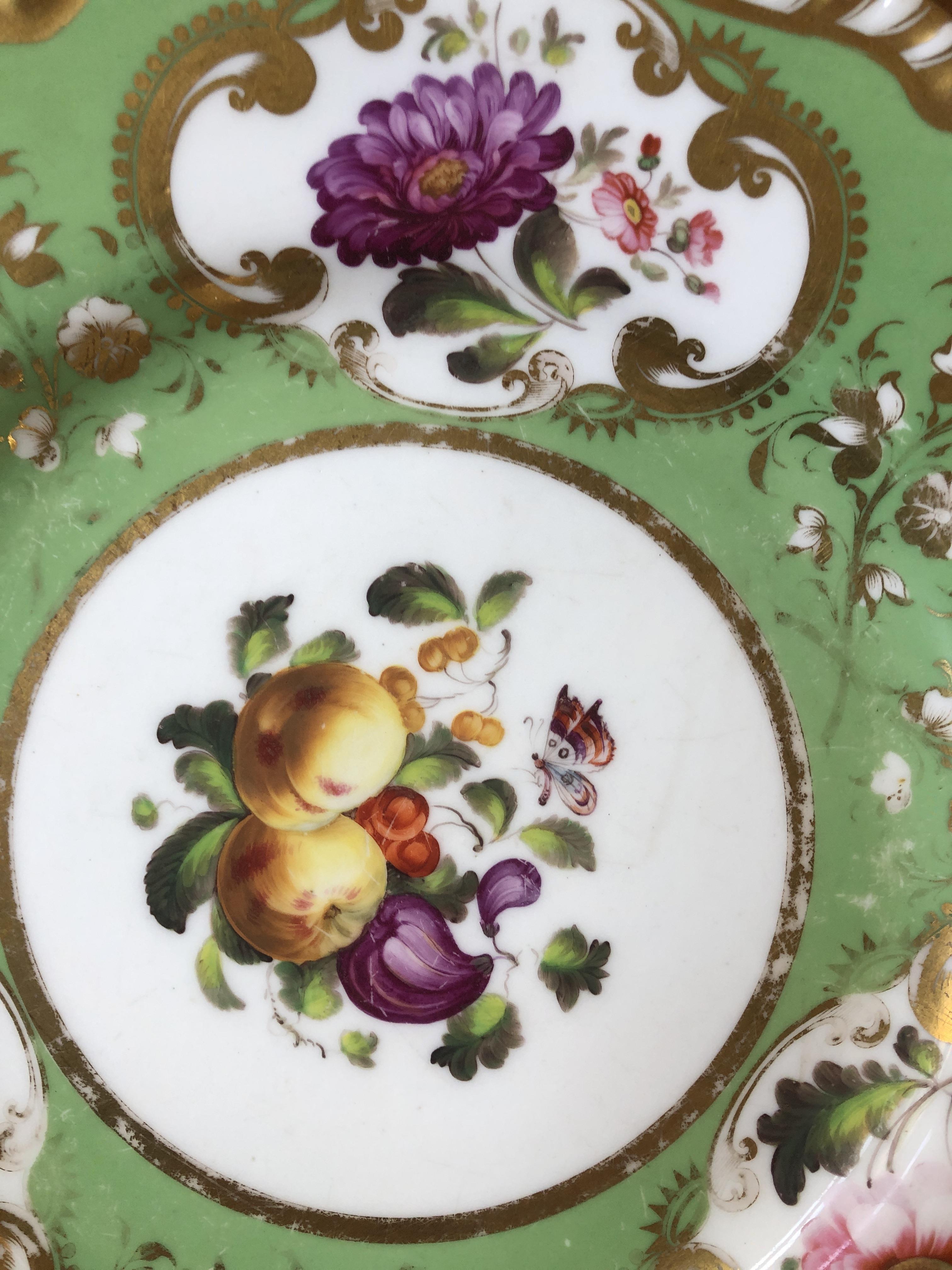 A 19th century hand painted dinner service, floral panels on a green ground, heightened in gilt, - Image 10 of 10