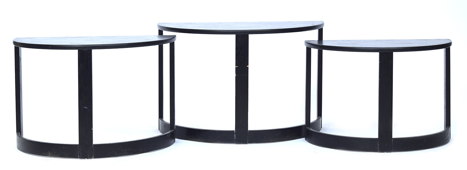 Three black ash demilune nesting side tables, 74cm wide, 41cm deep, 48.5cm high