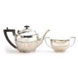 A George V silver teapot and sugar bowl by Charles Boyton & Son Ltd, London 1910 and 1911, the