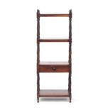 A Regency rosewood and mahogany four tier whatnot, on ring turned supports, the third shelf with