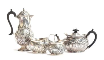 A late Victorian four piece tea and coffee set by Carrington & Co., London 1897, each piece half