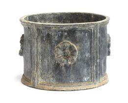 A heavy circular lead planter with floral decoration, 30cm diameter, 21cm high