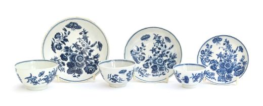 Three 18th century Worcester tea bowls and saucers in 'Three Flowers' pattern, the smallest bowl and