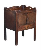 A George III mahogany tray top night commode, the gallery with cutout handles, over a pair of