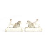 Two 19th century biscuit porcelain models of poodles on cushion form base, encrusted hair detail,