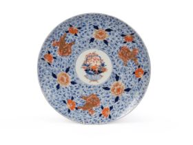 A large Japanese Imari charger, Meiji period, painted in underglaze blue and with iron-red and