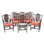 A set of eight George III mahogany dining chairs, probably Scottish, the shaped rails carved will