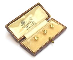 A cased set of three 18ct gold shirt studs, gross weight 3.6g