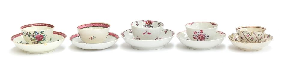 A group of five 18th century tea bowls and saucers, all with pink floral spray designs, to include a