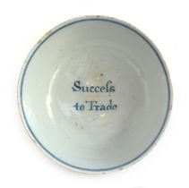 An 18th century English Delft bowl, the inside reading 'Success to Trade', 22cm diameter, 9.5cm high