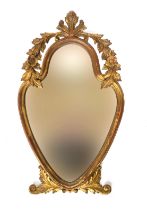 A gilt gesso 20th century Italian mirror, the shaped plate with carved foliate cresting; 80cm high