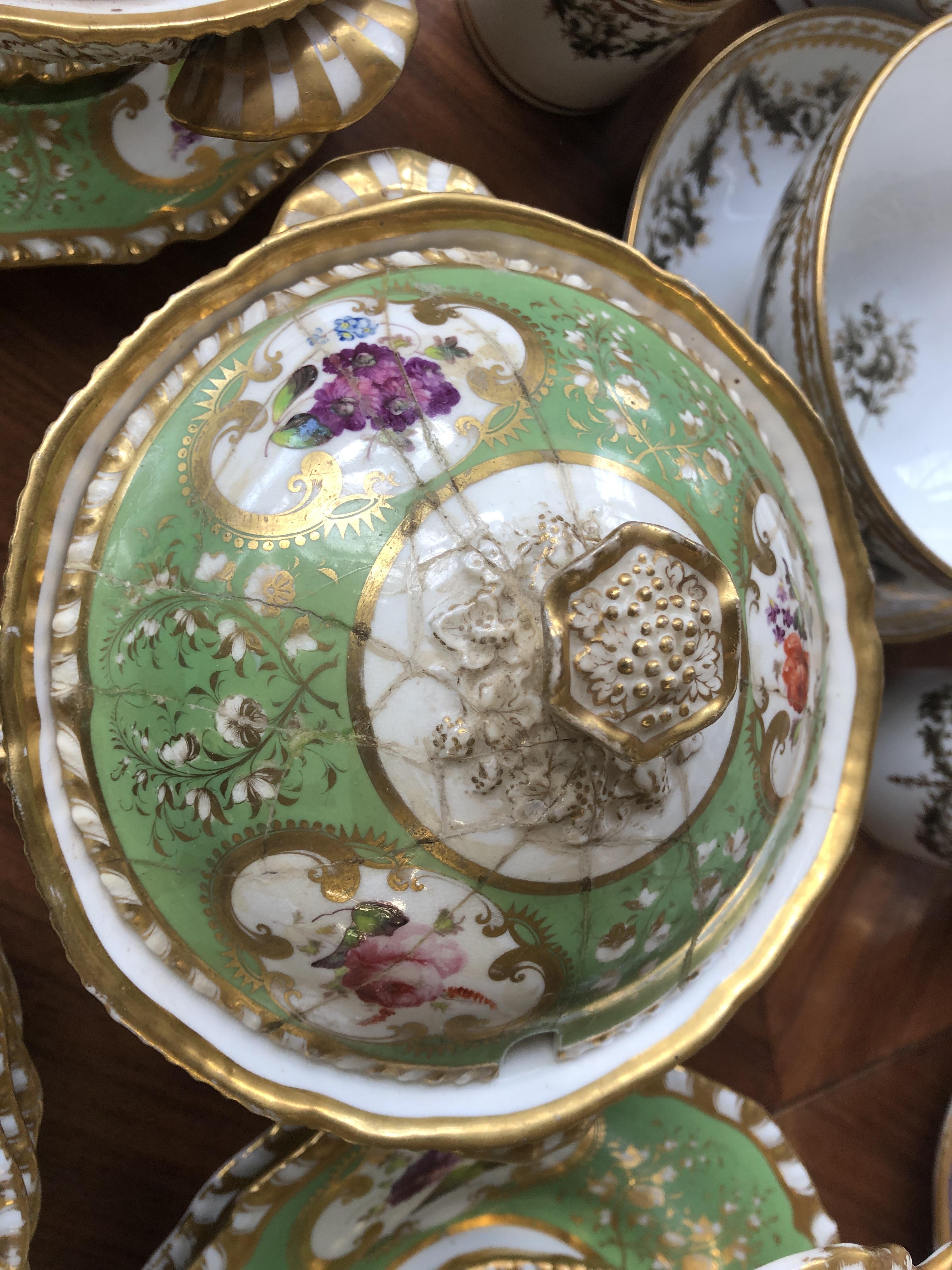 A 19th century hand painted dinner service, floral panels on a green ground, heightened in gilt, - Image 6 of 10