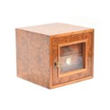 A Gentili burr walnut humidor, the glazed door opening to four drawers, 29.5cm wide, 28.5cm deep,