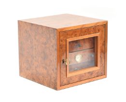 A Gentili burr walnut humidor, the glazed door opening to four drawers, 29.5cm wide, 28.5cm deep,