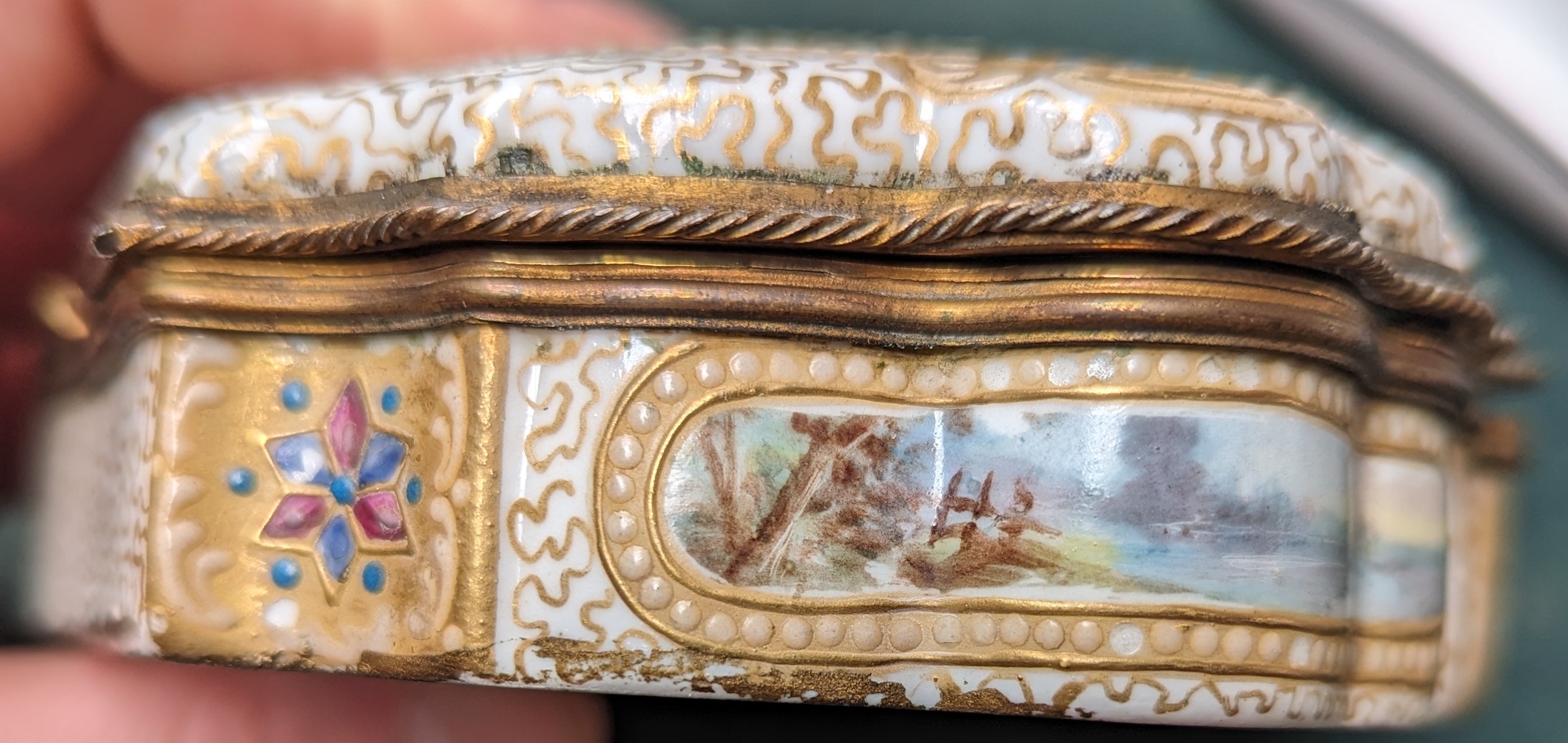A 19th century gilt metal mounted porcelain box, hand painted with pastoral scenes and heightened in - Image 9 of 11