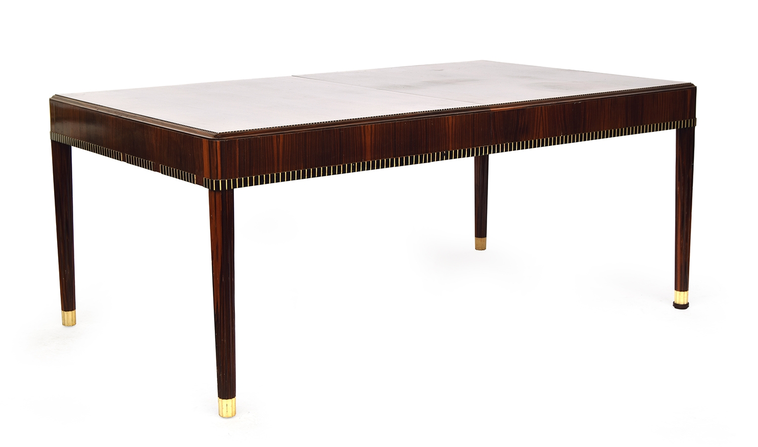 A French Art Deco maccasar ebony dining table, rectangular moulded top, on fluted tapering legs,