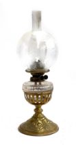 A late Victorian Hinks & Sons brass Duplex oil Lamp, floral design to base, the glass shade etched