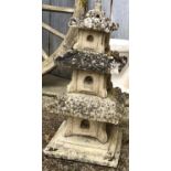 A composite stone three tiered pagoda, approx 67cmH