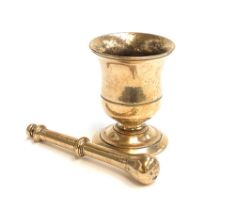 An 18th century brass pestle and mortar, 12cmH
