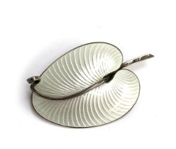 A Danish Volmer Bahner silver and white guilloche enamel brooch in the form of a stylised leaf,