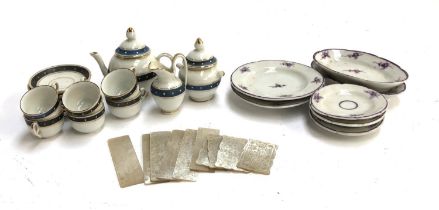 A 19th century doll's teaset, comprising teapot, six teacups and saucers, milk jug, and lidded sugar