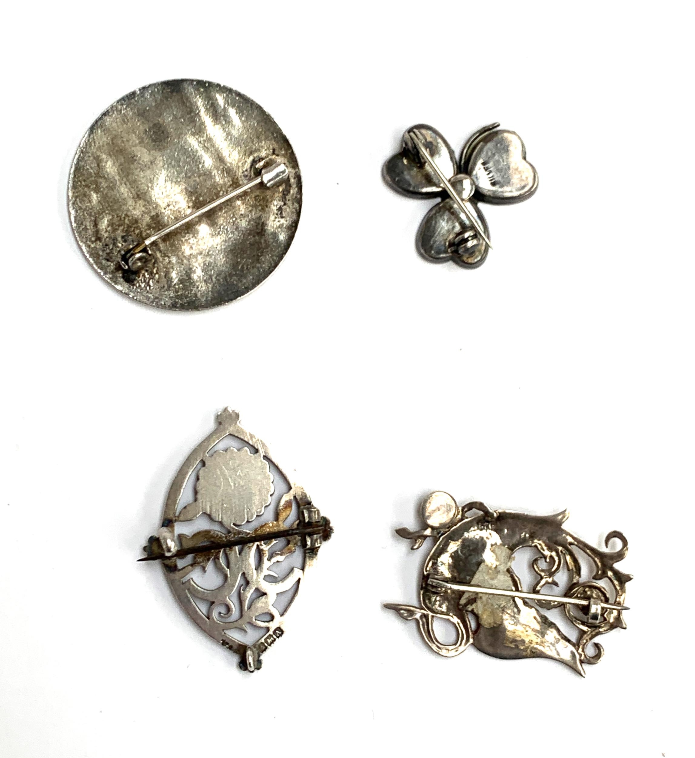 Four brooches: An early 20th century silver Connemara marble clover brooch, A silver Arts and Crafts - Image 2 of 4