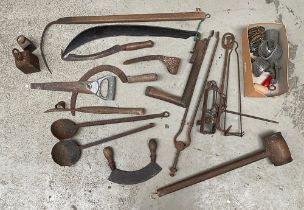 A quantity of vintage tools to include sickles, scythes, ladles, fire tongs, wooden mallet etc