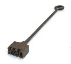 An early 20th century cattle branding iron 'D&M', 57cmL